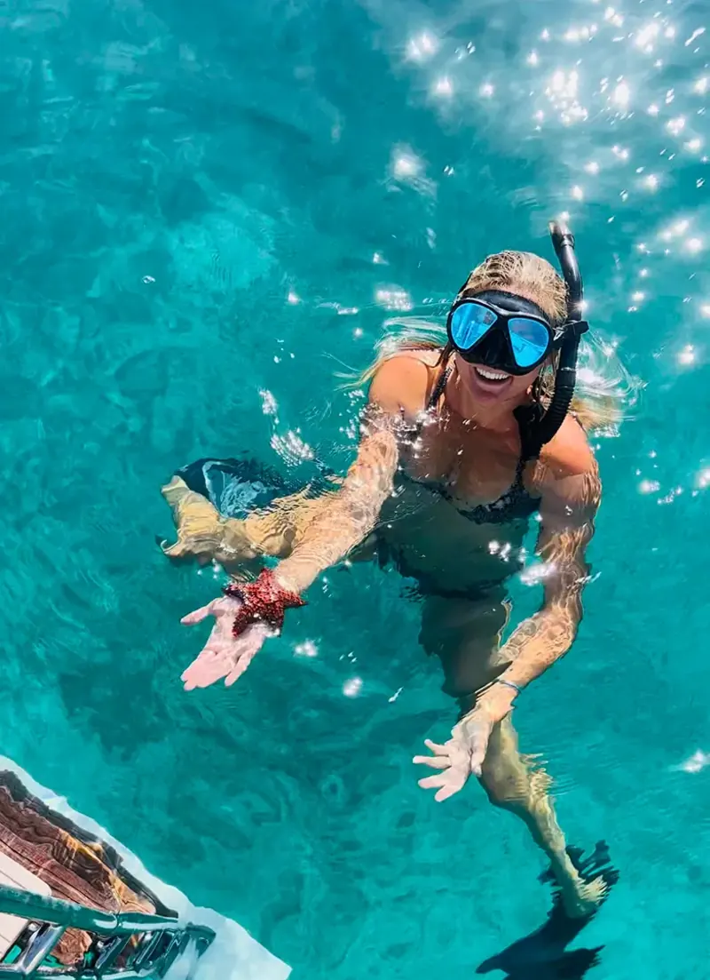 Woman holding a starfish